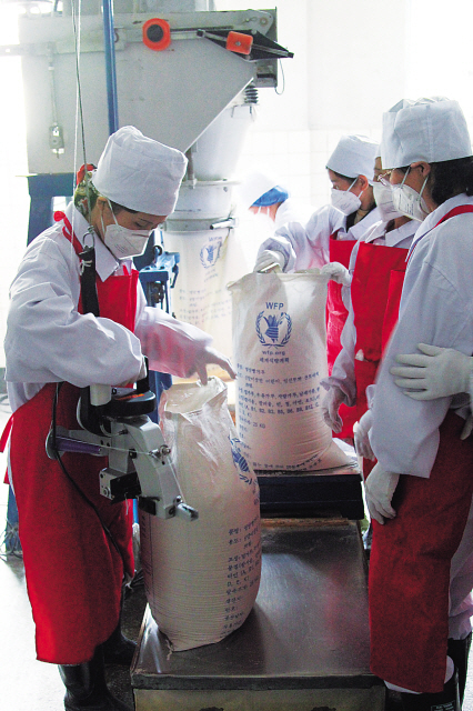 Workers package food aid at a World Food Programme-supported factory in
Pyongyang, North Korea. Irish Embassy