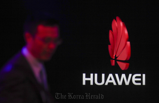 The logo of Huawei Technologies Co. is displayed at the Mobile World Congress exhibition in Barcelona.   Bloomberg