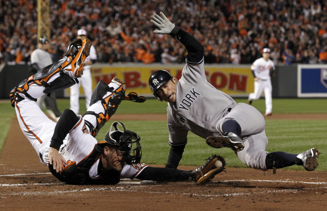 스즈키 이치로(Ichiro Suzuki/야구선수)
<YONHAP PHOTO-0516> New York Yankees' Ichiro Suzuki, right, of Japan, leaps past Baltimore Orioles catcher Matt Wieters to score a run on a double by Robinson Cano in the first inning of Game 2 of the American League division baseball series on Monday, Oct. 8, 2012, in Baltimore. (AP Photo/Alex Brandon)/2012-10-09 10:22:32/ <저작권자 ⓒ 1980-2012 ㈜연합뉴스. 무단 전재 재배포 금지.>
New York Yankees outfielder Ichiro Suzuki scores a run in the first inning on Monday.   AP-Yonhap News