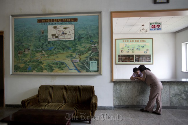 Employees confer at the reception desk of a hotel for foreign tourists in Gaeseong, North Korea, Sept. 11.   AP-Yonhap News