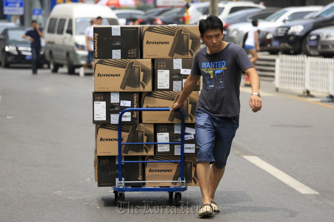 Lenovo Group Ltd. computers are transported in Beijing.    Bloomberg