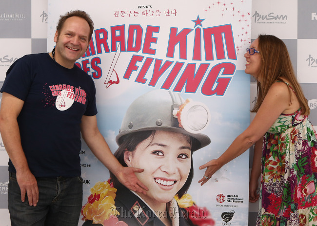 British director Nicholas Bonner (left) and Belgian filmmaker Anja Daelemans, who directed their film “Comrade Kim Goes Flying” with North Korean director Kim Gwang-hun, pose for a photo during the 17th Busan International Film Festival in Busan on Wednesday.   Yonhap News
