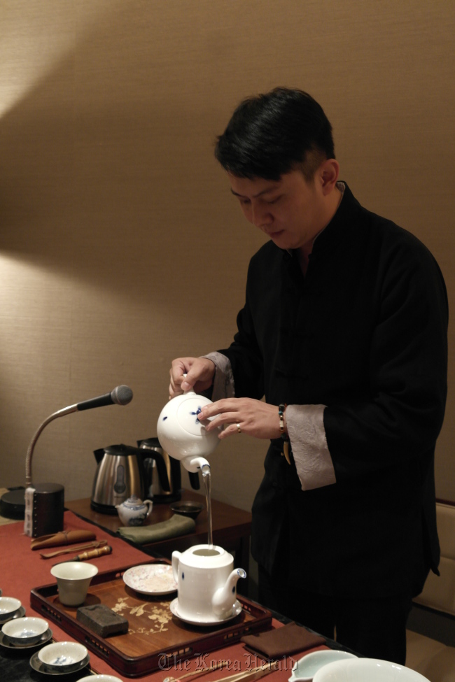 Tea sommelier Wei Lei performs a traditional tea ceremony.   The Shilla Seoul
