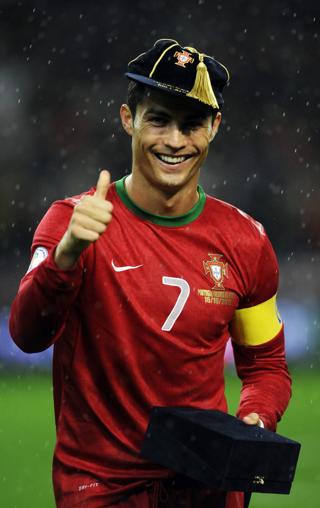 Portugal’s Cristiano Ronaldo is honored for his 100th international cap.   AP-Yonhap News