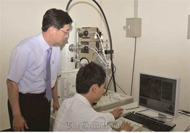 Scientists at Korea University at their lab researching materials for organic FETs.
