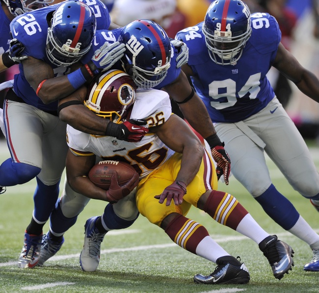 다렐 영(Darrel Young/미식축구선수/워싱턴 레드스킨스)
Washington Redskins fullback Darrel Young is brought down by the New York Giants defense on Sunday.   AP-Yonhap News