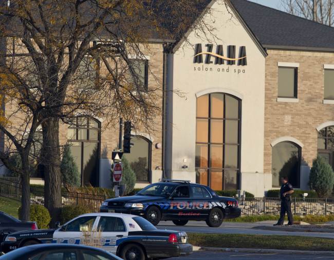 Police personnel work outside the Azana Salon and Spa where three people were killed and four others wounded after a mass shooting in Brookfield, Wisconsin, Sunday.   AFP-Yonhap News