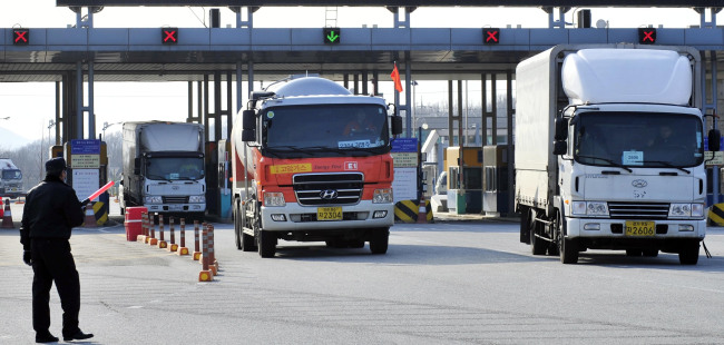 South Korean trucks depart Gaeseong Industrial Complex in North Korea.   The Korea Herald