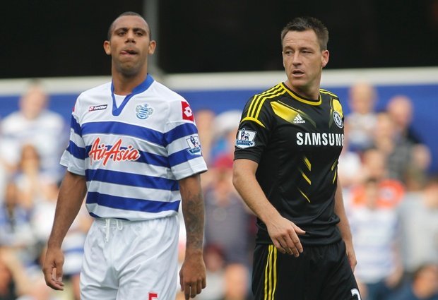 Queens Park Rangers' Anton Ferdinand, left, is marked by Chelsea's John Terry as Chelsea defend a corner during their English Premier League soccer match at Loftus Road stadium, London. (AP)