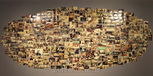 A collection of photographs of Templestay participants and others are on display at the “Self-Made Inspiration and Laughter Exhibition” at Sejong Museum of Arts in Seoul on Wednesday.   Lee Sang-sub/The Korea Herald