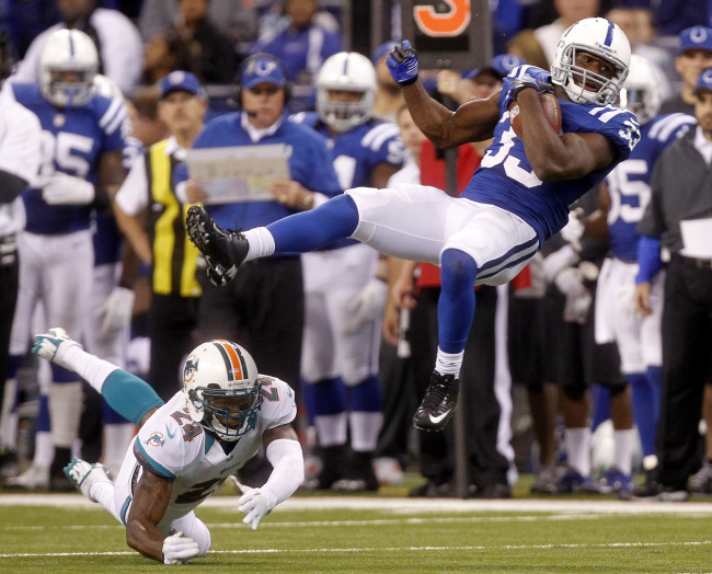 Indianapolis Colts running back Vick Ballard is tripped up after a 15-yard reception on Sunday.   UPI-Yonhap News