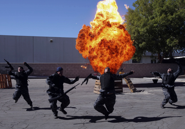 The State Fire Marshall held a three-day class to educate fire inspectors about the use of explosives on film sets. Here, stunt people react to an explosion during one of the scenarios, Oct. 25, 2012, in Burbank, California. (Michael Robinson Chavez/Los Angeles Times/MCTeye)
