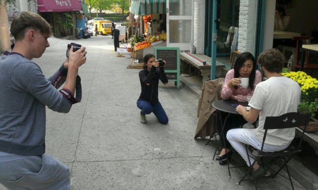 Team members of Perhaps Nightshade film a scene in Seoul using DSLR cameras.   Emma Kalka/The Korea Herald