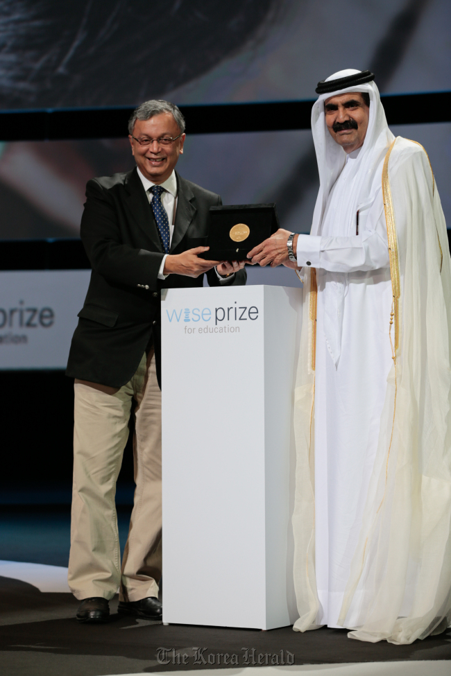 Madhav Chavan of India receives the 2012 WISE Prize for Education from Emir of the State of Qatar Sheikh Hamad bin Khalifa Al Thani on Tuesday in Doha.   WISE
