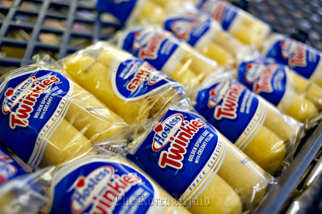 Hostess Brands Inc. Twinkies snacks sit on a shelf inside the company’s outlet store in Peoria, Illinois.   Bloomberg