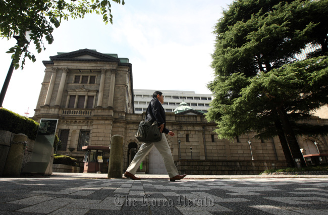 The Bank of Japan headquarters stands in Tokyo.   Bloomberg