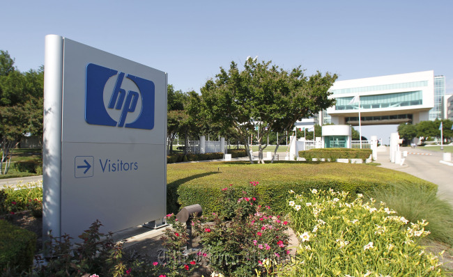 The Hewlett-Packard Co. logo is displayed outside the company’s HP Enterprise Services unit in Plano, Texas.   Bloomberg