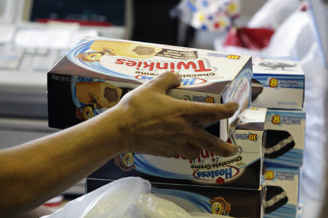 A cashier rings up boxes of Hostess Twinkies at the Hostess Brands’ bakery in Denver.    AP-Yonhap News
