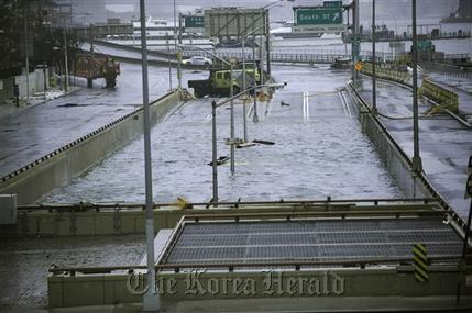 This Oct. 30, 2012, file photo shows water reaching the street level of the flooded Battery Park Underpass, Tuesday in New York, remnants from Superstorm Sandy. Extreme weather is a growing threat to the nation’s lifelines ― its roads, bridges, railways, airports and transit systems ― leaving states and cities trying to come to terms with a new normal.   AP Photo/Louis Lanzano, file
This Oct. 30, 2012, file photo shows water reaching the street level of the flooded Battery Park Underpass, Tuesday in New York, remnants from Superstorm Sandy. Extreme weather is a growing threat to the nation’s lifelines ― its roads, bridges, railways, airports and transit systems ― leaving states and cities trying to come to terms with a new normal.   AP Photo/Louis Lanzano, file