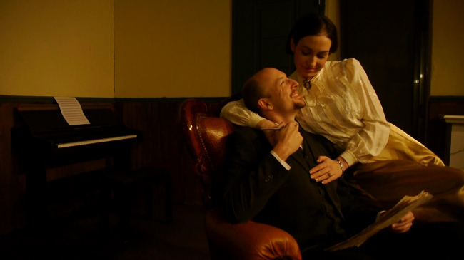 Kirk Dickens appears as Torvald and Desiree Munro as Nora in Henrik Ibsen’s “A Doll’s House” at White Box Theater.   Probationary Theatre Company