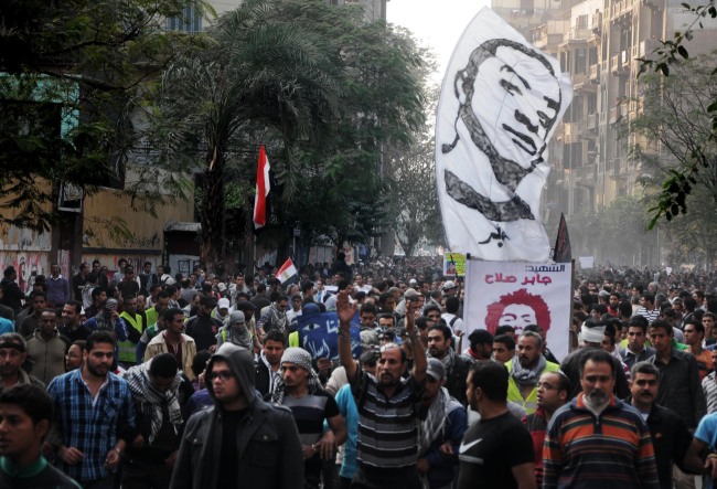 Egyptians attend the funeral of Gaber Salah, who was killed during clashes with security forces in Cairo, on Monday.   AP-Yonhap News