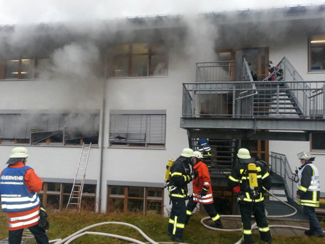 In this image taken from video, firefighters try to extinguish flames in a workshop for disabled people in Titisee-Neustadt, southwestern Germany, Monday. AP-Yonhap News