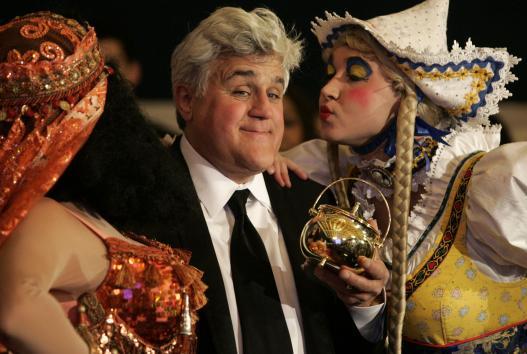 Television host Jay Leno stands with Harvard University Hasty Pudding Theatricals cast members after being presented with the 2011 Man of the Year award at the New College Theatre in Cambridge, Massachusetts on February 04, 2011. (UPI)