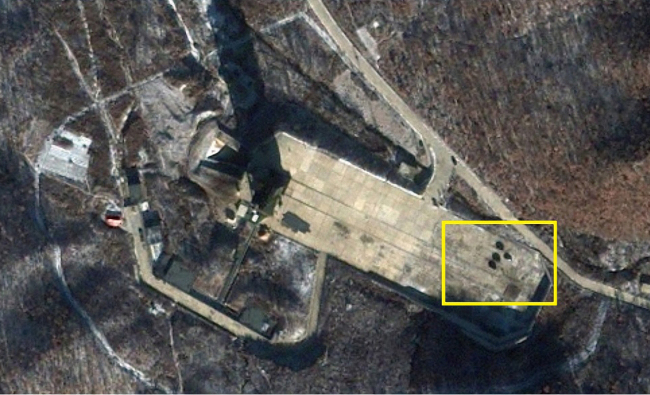 This Tuesday satellite image provided by Geoeye Satellite Image shows trucks believed to be used for fuel transportation or maintenance at the rocket launch site in North Korea.   Yonhap News