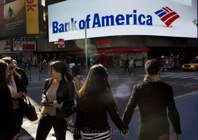 Pedestrians pass a Bank of America branch in New York.   Bloomberg