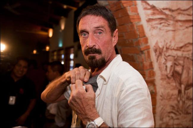 Software company founder John McAfee adjusts a microphone in preparation for an interview in Guatemala City, Tuesday, Dec. 4, 2012. (AP)
