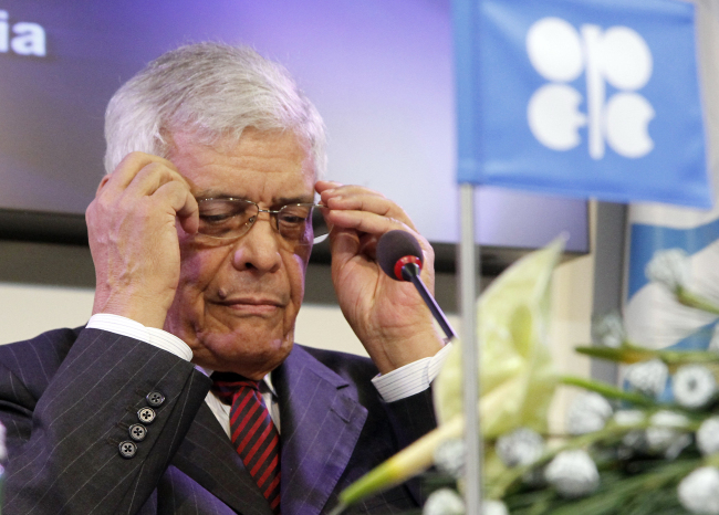 Secretary General of OPEC Abdalla Salem El-Badri of Libya adjusts his glasses during a news conference after a meeting of the Organization of the Petroleum Exporting Countries in Vienna on Wednesday.    AP-Yonhap News