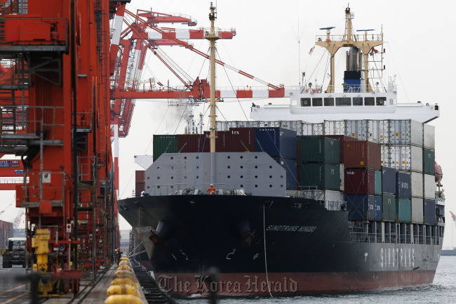The Sinotrans Ningbo container ship sails out of a shipping terminal in Tokyo on Tuesday.    Bloomberg