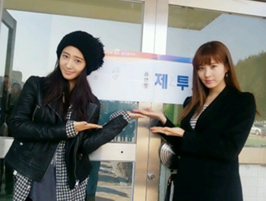 Singer Yuri and Seohyun, members of Korean idol group Girl's Generation, pose in front of a polling station in Seoul. (SM Entertainment)