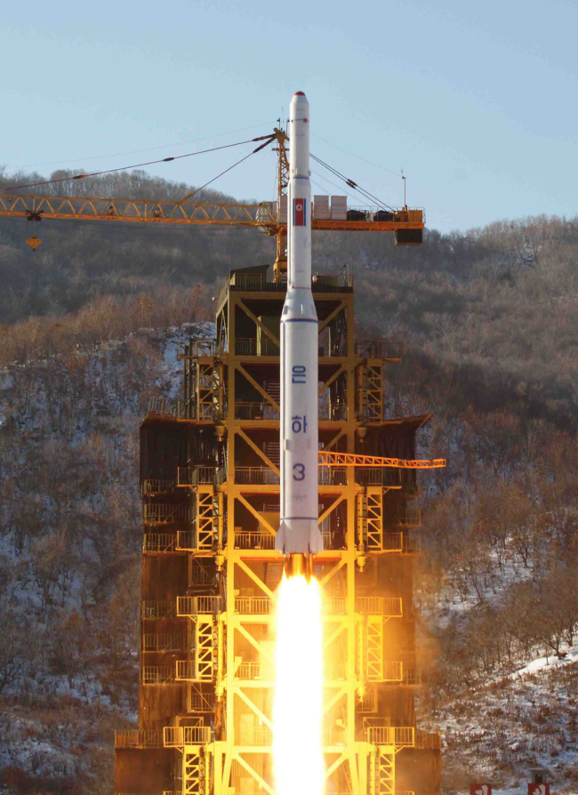 In this Dec. 12 file photo released by the North’s Korean Central News Agency, the Unha-3 rocket lifts off from the launch pad in North Korea. AP-Yonhap News
