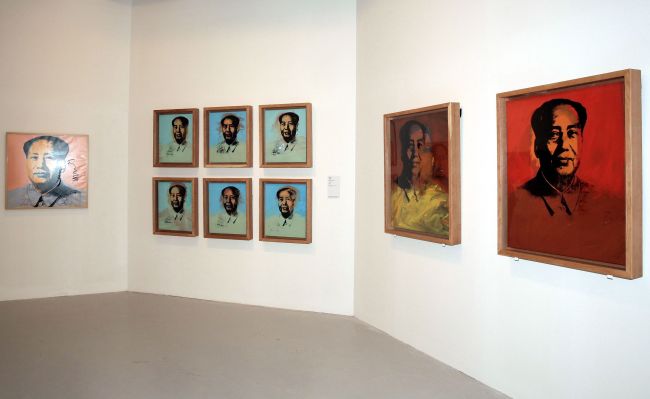 An undated handout photo released by the Hong Kong Museum of Art on Wednesday shows portraits of former Chinese leader Mao Zedong on display during the art exhibition “Andy Warhol: 15 Minutes Eternal” in Hong Kong.   AFP-Yonhap News