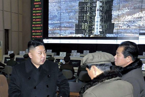 This undated photo released by the North’s Korea Central News Agency shows leader Kim Jong-un meeting scientists at its rocket launch site in Cheolsan, Pyeongan Province. (Yonhap News)