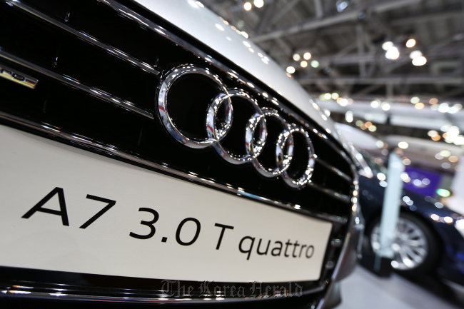 The Audi AG logo is displayed on a A7 3.0 T quattro sedan at a dealership in Seoul.   Bloomberg