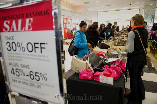 Shoppers browse handbags on sale at a Bloomingdale’s store in the Westfield San Francisco Centre in San Francisco, California.    Bloomberg