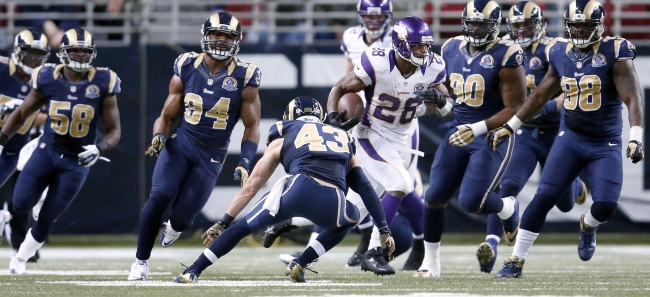Minnesota Vikings running back Adrian Peterson is 207 yards shy of Eric Dickerson’s single-season record.   MCT