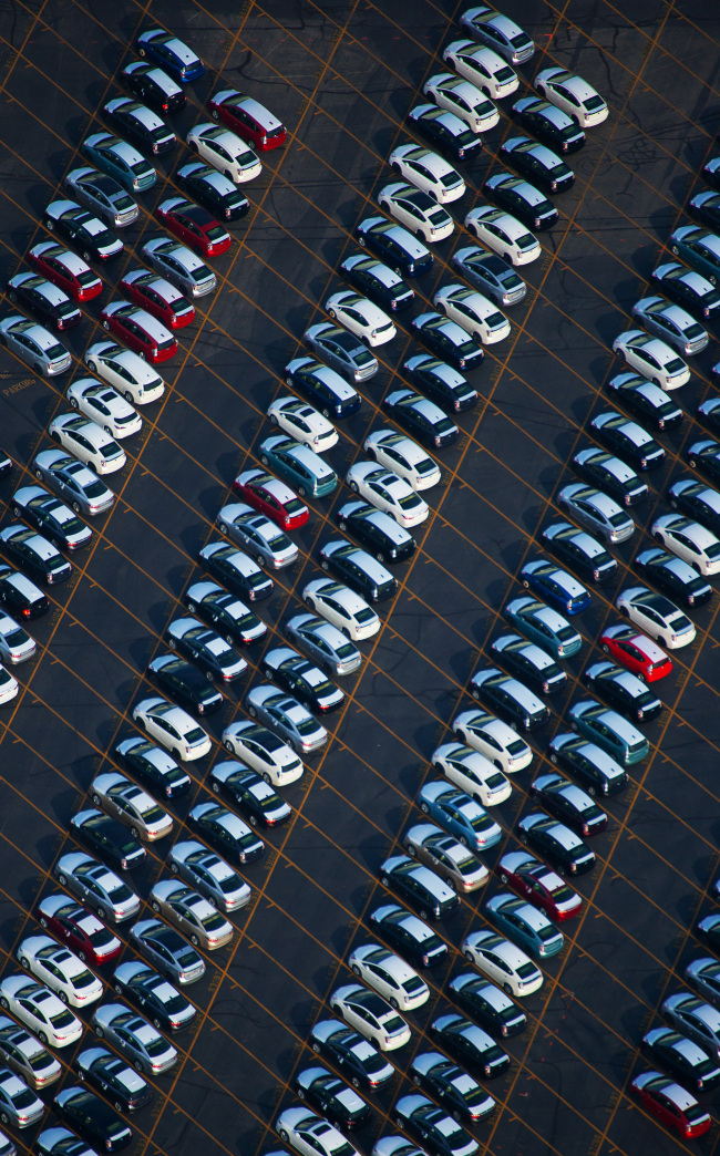 Rows of Toyota Motor Corp. vehicles sit lined up, waiting to be picked up by dealers at the Port of Long Beach in Long Beach, California.  Bloomberg