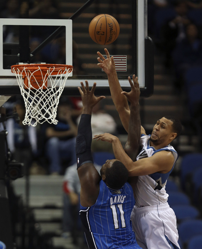 Minnesota Timberwolves guard Brandon Roy (right) blocks the shot of Orlando Magic forward Glen Davis in early November.   MCT