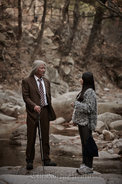 Actor Song Kang-ho (left) stars as a pansori artist in Park Chan-wook and Park Chan-kyong’s latest short “Day Trip.”   Moho films