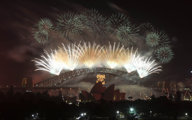 Fireworks explode in the sky above Sydney Harbor during the New Year celebrations in Sydney, Australia, Tuesday.   AP-Yonhap News