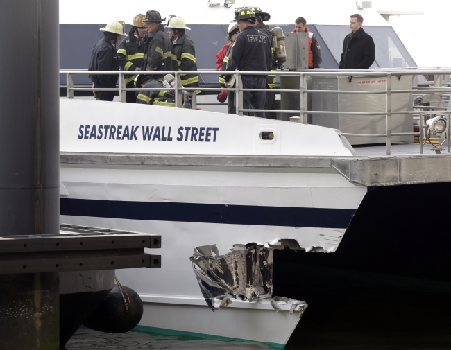 New York City firefighters walk the deck of the Seastreak Wall Street ferry in New York on Wednesday.   AP-Yonhap News