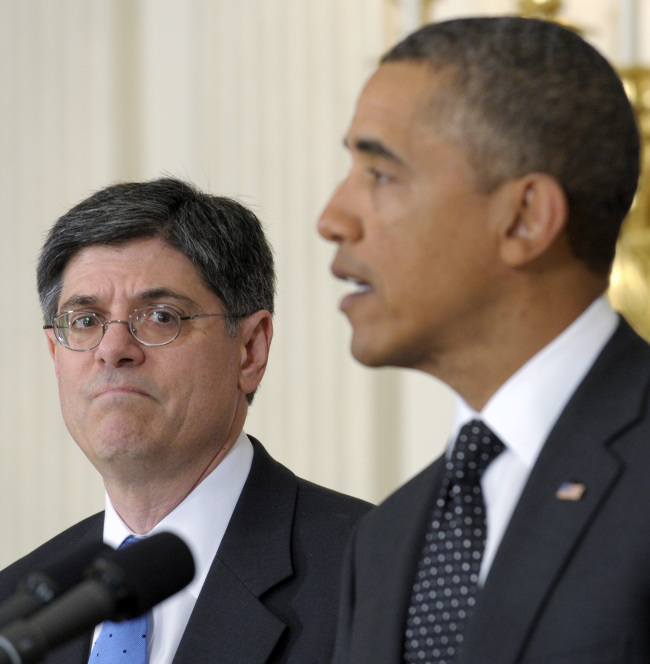 This file photo shows then-Budget Director Jack Lew (left) listening as President Barack Obama speaks in the State Dining Room of the White House in Washington.   AP-Yonhap News