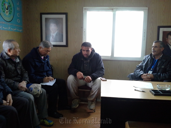 Pastor Kim Jang-hwan (far left) meets with workers at the Zaatari refugee camp in Jordan.   Far East Broadcasting Corporation