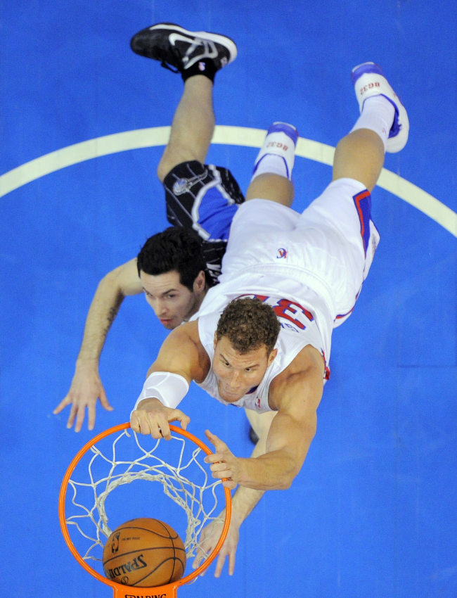 Los Angeles Clippers forward Blake Griffin dunks over Orlando Magic guard J.J. Redick on Saturday.   AP-Yonhap News
