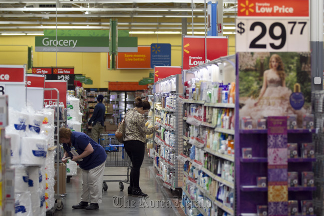A woman shops at a Wal-Mart store in Alexandria, Virginia.   Bloomberg