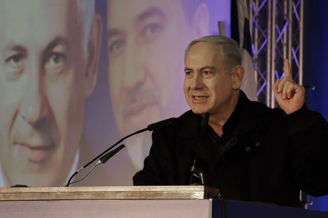 Israeli Prime Minister Benjamin Netanyahu speaks during a Likud-Yisrael Beitenu campaign rally in Ashdod, Israel, Wednesday.   AP-Yonhap News