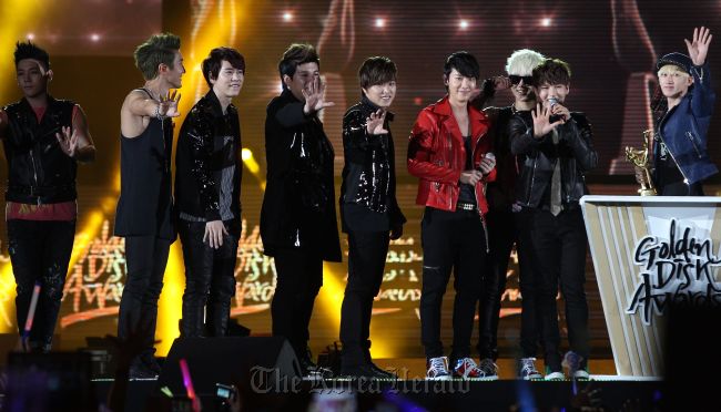 K-Pop group Super Junior receive their awards on stage during the Samsung Galaxy 27th Golden Disk Awards at the Sepang International Circuit in Sepang, outside Kuala Lumpur on Tuesday.    AFP-Yonhap News